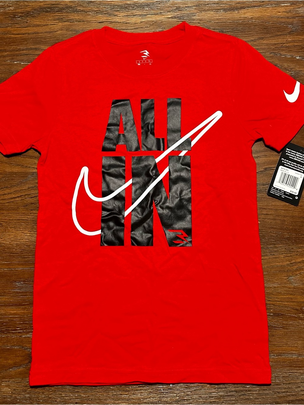 Kids Nike Red Short Sleeve Tee with Black "ALL IN" Graphic and White Swoosh